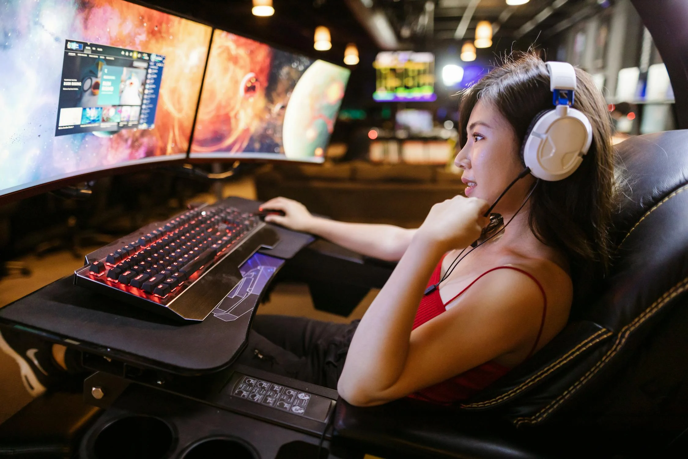 gamer girl sitting in front of a computer screen